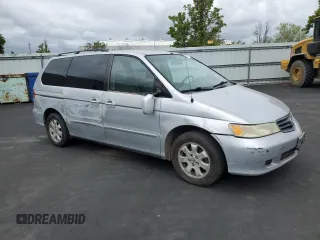 2002 Honda Odyssey EX-L with VIN 2HKRL18902H506828, listed as a Copart auction lot 53735625 with 214,446 mi miles and Salvage title. Bid and sale history available at DreamBid. Image 4.