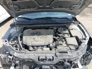 2016 Mazda Mazda3 i Sport with VIN JM1BM1T71G1335980, listed as a IAAI auction lot 42003186 with 131,015 mi miles. Bid and sale history available at carsss.com. Image 10.