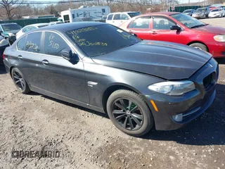 2012 BMW 5 Series 528i xDrive with VIN WBAXH5C5XCDW02071, listed as a IAAI auction lot 41831852 with 999,999 mi miles. Bid and sale history available at carsss.com. Image 1.