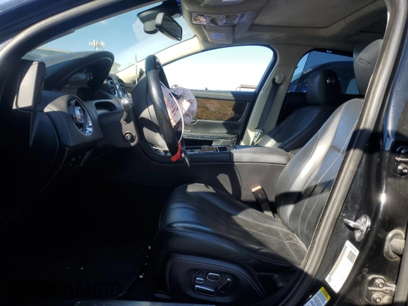 2014 Jaguar XJ with VIN SAJWA2GZXE8V59542, listed as a Copart auction lot 73672614 with 105,328 mi miles and Salvage Title. Bid and sale history available at carsss.com. Image 7.