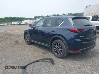 2018 Mazda CX-5 Grand Touring with VIN JM3KFBDMXJ0361812, listed as a IAAI auction lot 42509752 with 131,386 mi miles and . Bid and sale history available at DreamBid. Image 3.