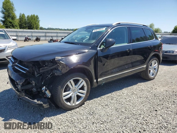 2013 Volkswagen Touareg Lux with VIN WVGEF9BP0DD001565, listed as a Copart auction lot 63070845 with 123,788 mi miles and Salvage title. Bid and sale history available at DreamBid. Image 1.