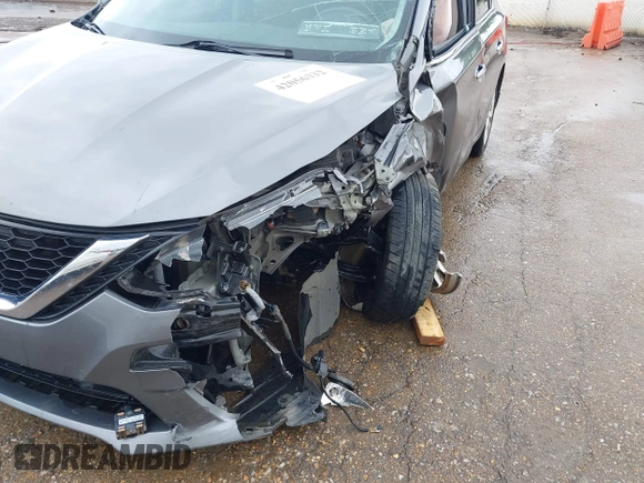 2019 Nissan Sentra S z VIN 3N1AB7AP7KY364754, wystawiony jako IAAI lot #42056332 z przebiegiem 170 068 mil mil oraz . Historia ofert i sprzedaży dostępna na DreamBid. Obrazek 17.
