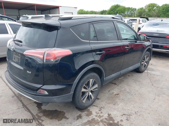 2016 Toyota RAV4 XLE with VIN 2T3WFREV9GW276278, listed as a IAAI auction lot 41906293 with 112,000 mi miles. Bid and sale history available at carsss.com. Image 4.