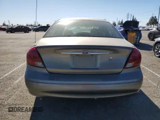 2001 Ford Taurus LX Standard z VIN 1FAFP52U51A138332, wystawiony jako Copart lot #88528355 z przebiegiem 166 511 mil mil oraz Szkoda całkowita • Salvage title. Historia ofert i sprzedaży dostępna na DreamBid. Obrazek 6.