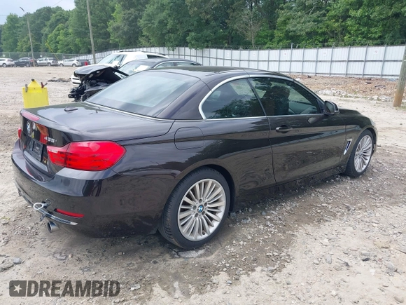 2014 BMW 4 Series 435i with VIN WBA3T3C50EJ876997, listed as a IAAI auction lot 42406299 with 115,048 mi miles and . Bid and sale history available at DreamBid. Image 4.