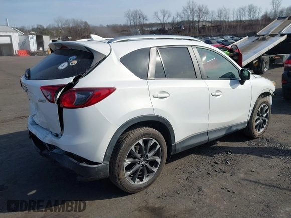2016 Mazda CX-5 Grand Touring with VIN JM3KE4DYXG0836692, listed as a IAAI auction lot 41812584 with 119,302 mi miles. Bid and sale history available at carsss.com. Image 4.