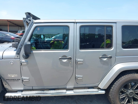2013 Jeep Wrangler Unlimited Sahara with VIN 1C4BJWEG4DL666930, listed as a IAAI auction lot 42310569 with 206,577 mi miles and . Bid and sale history available at DreamBid. Image 14.