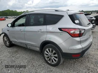 2017 Ford Escape Titanium with VIN 1FMCU0J96HUC12822, listed as a Copart auction lot 54259375 with 127,114 mi miles and Salvage Title. Bid and sale history available at DreamBid. Image 2.