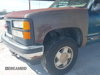 1995 GMC Suburban z VIN 1GKFK16K9SJ728534, wystawiony jako IAAI lot #42358029 z przebiegiem 279 148 mil mil oraz . Historia ofert i sprzedaży dostępna na DreamBid. Obrazek 15.