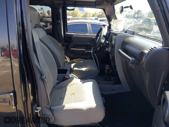 2008 Jeep Wrangler Unlimited Rubicon with VIN 1J8GA69108L574773, listed as a IAAI auction lot 42714300 with 106,974 mi miles and . Bid and sale history available at DreamBid. Image 5.
