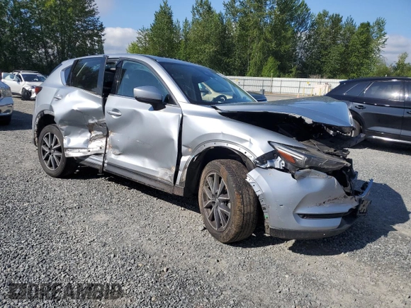 2018 Mazda CX-5 Grand Touring с VIN JM3KFBDM5J0323923, выставлен на аукционе Copart как лот 58162435 с пробегом 144 792 миль миль и Списание • Salvage title. История ставок и продаж доступна на DreamBid. Изображение 4.