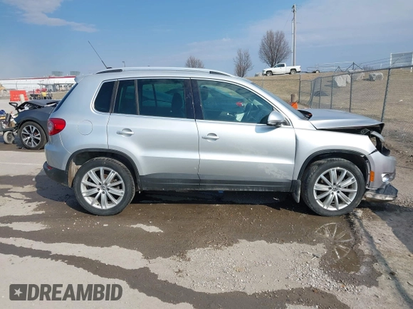 2011 Volkswagen Tiguan SE with VIN WVGBV7AX2BW562055, listed as a IAAI auction lot 41642084 with 175,407 mi miles and . Bid and sale history available at DreamBid. Image 13.