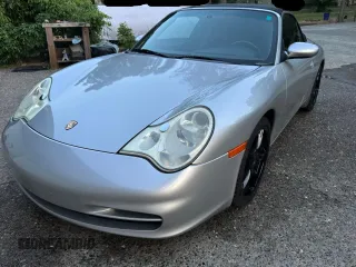 2004 Porsche 911 Carrera z VIN WP0CA299X4S651377, wystawiony jako Copart lot #60941235 z przebiegiem 139 410 mil mil oraz Szkoda całkowita • Salvage title. Historia ofert i sprzedaży dostępna na DreamBid. Obrazek 2.