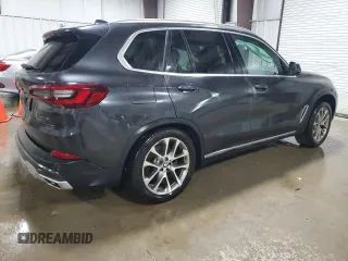 2020 BMW X5 xDrive40i with VIN 5UXCR6C09L9C51165, listed as a Copart auction lot 58212555 with Not provided miles and Salvage title. Bid and sale history available at DreamBid. Image 3.