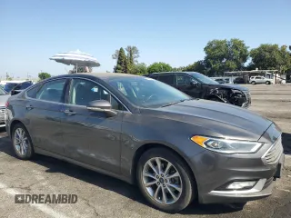 2017 Ford Fusion SE with VIN 3FA6P0HD7HR247627, listed as a Copart auction lot 61872975 with 230,032 mi miles and Salvage title. Bid and sale history available at DreamBid. Image 4.