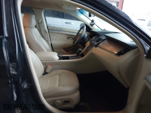 2015 Ford Taurus SEL z VIN 1FAHP2E87FG203272, wystawiony jako IAAI lot #41717231 z przebiegiem 95 829 mil mil oraz . Historia ofert i sprzedaży dostępna na DreamBid. Obrazek 5.