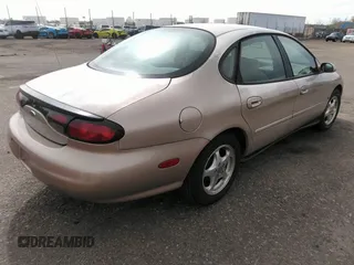 1999 Ford Taurus SE with VIN 1FAFP53S9XA330603, listed as a IAAI auction lot 41819819 with 207,025 mi miles. Bid and sale history available at carsss.com. Image 4.