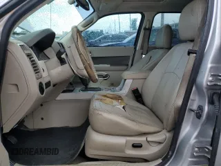 2010 Mercury Mariner Premier with VIN 4M2CN8HG3AKJ06165, listed as a Copart auction lot 50501905 with 229,937 mi miles and Salvage title. Bid and sale history available at DreamBid. Image 7.