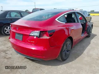 2020 Tesla Model 3 Long Range with VIN 5YJ3E1EB6LF649824, listed as a IAAI auction lot 41766020 with 71,230 mi miles. Bid and sale history available at carsss.com. Image 4.