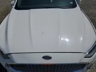 2020 Ford Fusion Titanium с VIN 3FA6P0K99LR174094, выставлен на аукционе Copart как лот 52583435 с пробегом 98 389 миль миль и Списание • Salvage title. История ставок и продаж доступна на DreamBid. Изображение 12.