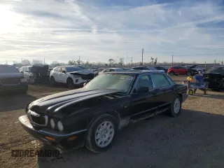 1998 Jaguar XJ with VIN SAJHX1245WC819762, listed as a Copart auction lot 81480174 with 132,491 mi miles and Salvage Title. Bid and sale history available at DreamBid. Image 1.
