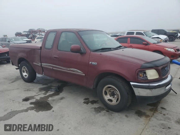 1997 Ford F-150 with VIN 2FTDX1726VCA74811, listed as a Copart auction lot 81909844 with 136,520 mi miles and Salvage title. Bid and sale history available at DreamBid. Image 4.