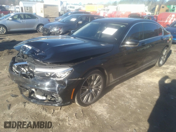 2018 BMW 7 Series 740i with VIN WBA7E2C57JG742257, listed as a IAAI auction lot 41353435 with 77,125 mi miles. Bid and sale history available at carsss.com. Image 2.