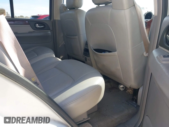 2006 GMC Envoy SLT with VIN 1GKDS13S062128531, listed as a IAAI auction lot 41458983 with 119,385 mi miles. Bid and sale history available at carsss.com. Image 8.