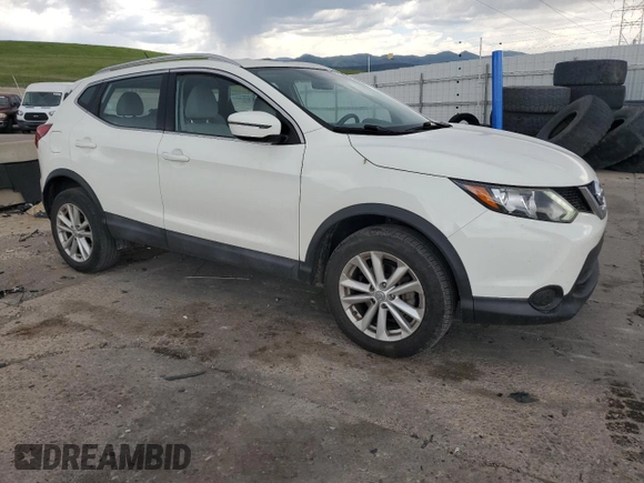 2017 Nissan Rogue SV with VIN JN1BJ1CP5HW010989, listed as a Copart auction lot 59119805 with 82,632 mi miles and Salvage title. Bid and sale history available at DreamBid. Image 4.