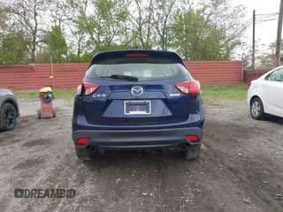 2013 Mazda CX-5 Sport with VIN JM3KE2BE1D0160254, listed as a IAAI auction lot 42256555 with 136,476 mi miles and . Bid and sale history available at DreamBid. Image 16.