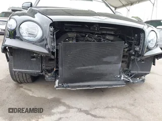 2022 Bentley Bentayga V8 z VIN SJAAM2ZV1NC013849, wystawiony jako IAAI lot #42176939 z przebiegiem 15 292 mil mil oraz . Historia ofert i sprzedaży dostępna na DreamBid. Obrazek 6.