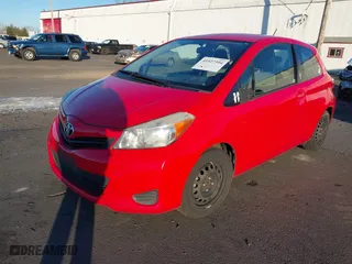 2012 Toyota Yaris L with VIN JTDJTUD31CD537755, listed as a IAAI auction lot 41527394 with 102,783 mi miles. Bid and sale history available at carsss.com. Image 17.