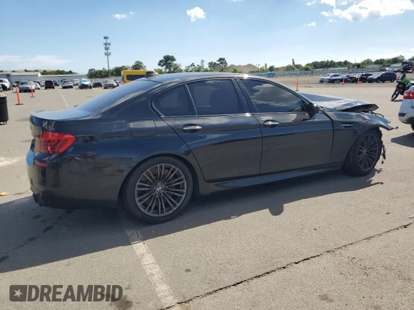 2014 BMW M5 z VIN WBSFV9C53ED594132, wystawiony jako Copart lot #67114384 z przebiegiem 89 020 mil mil oraz Szkoda całkowita • Salvage title. Historia ofert i sprzedaży dostępna na DreamBid. Obrazek 3.