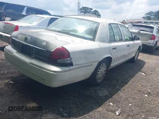 2008 Mercury Grand Marquis LS with VIN 2MEFM75VX8X600015, listed as a IAAI auction lot 42142359 with 310,481 mi miles and . Bid and sale history available at DreamBid. Image 4.