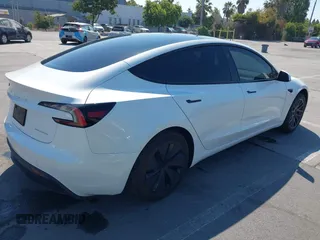 2025 Tesla Model 3 Long Range with VIN 5YJ3E1EB3SF914858, listed as a IAAI auction lot 42719707 with 5,849 mi miles and . Bid and sale history available at DreamBid. Image 4.