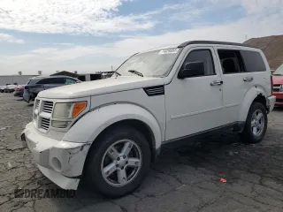 2010 Dodge Nitro SXT z VIN 1D4PT5GK8AW100343, wystawiony jako Copart lot #74628804 z przebiegiem 156 612 mil mil oraz Szkody całkowita. Historia ofert i sprzedaży dostępna na DreamBid. Obrazek 1.