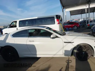 2012 BMW 6 Series 650i with VIN WBALX3C52CC528401, listed as a IAAI auction lot 42046910 with 105,844 mi miles. Bid and sale history available at carsss.com. Image 14.