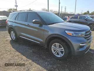 2022 Ford Explorer XLT with VIN 1FMSK8DH7NGA82496, listed as a Copart auction lot 51866865 with 77,014 mi miles and Clean Title. Bid and sale history available at carsss.com. Image 4.