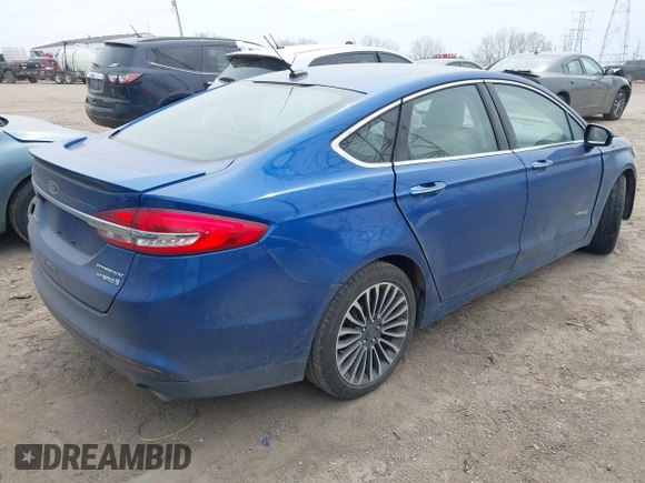 2017 Ford Fusion Hybrid Titanium с VIN 3FA6P0RU5HR388615, выставлен на аукционе IAAI как лот 42066142 с пробегом 121 618 миль миль и . История ставок и продаж доступна на DreamBid. Изображение 4.