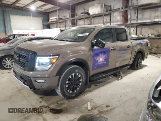 2020 Nissan Titan SL with VIN 1N6AA1EDXLN503963, listed as a Copart auction lot 56694005 with 61,341 mi miles and Salvage title. Bid and sale history available at DreamBid. Image 1.