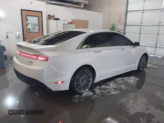 2014 Lincoln MKZ with VIN 3LN6L2J92ER836146, listed as a IAAI auction lot 41583343 with 130,613 mi miles. Bid and sale history available at carsss.com. Image 4.
