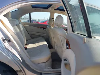 2003 Mercedes-Benz E-Class 3.2L with VIN WDBUF65J93X099223, listed as a IAAI auction lot 42033473 with 230,758 mi miles. Bid and sale history available at carsss.com. Image 8.