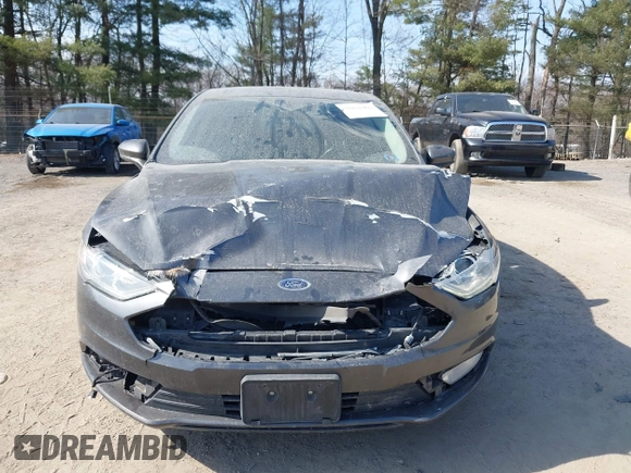 2018 Ford Fusion SE z VIN 3FA6P0LU6JR118226, wystawiony jako IAAI lot #41811406 z przebiegiem 165 352 mil mil oraz . Historia ofert i sprzedaży dostępna na DreamBid. Obrazek 13.