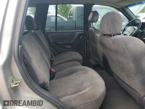 2000 Jeep Grand Cherokee Laredo with VIN 1J4GW48S9YC390448, listed as a Copart auction lot 56985265 with Not provided miles and Salvage title. Bid and sale history available at DreamBid. Image 11.