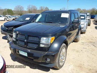2011 Dodge Nitro Heat with VIN 1D4PU4GX7BW565927, listed as a IAAI auction lot 41803129 with 84,980 mi miles. Bid and sale history available at carsss.com. Image 2.