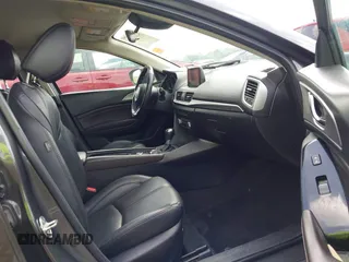 2018 Mazda 3 Touring z VIN 3MZBN1L35JM271525, wystawiony jako IAAI lot #42112552 z przebiegiem 107 299 mil mil oraz . Historia ofert i sprzedaży dostępna na DreamBid. Obrazek 5.