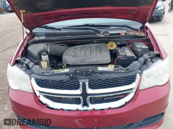 2014 Dodge Grand Caravan SXT with VIN 2C4RDGCG4ER120877, listed as a IAAI auction lot 42142083 with 199,895 mi miles and . Bid and sale history available at DreamBid. Image 10.