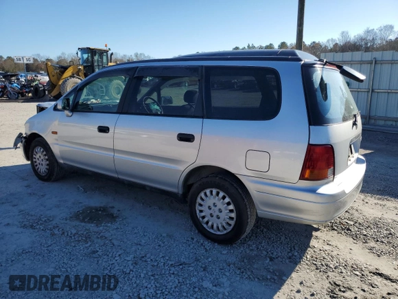 1997 Honda Odyssey with VIN RA11239041, listed as a Copart auction lot 85819024 with 79,952 mi miles and Salvage title. Bid and sale history available at DreamBid. Image 2.