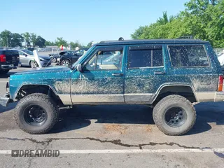 1995 Jeep Cherokee Sport z VIN 1J4FJ68S7SL623451, wystawiony jako IAAI lot #42581407 z przebiegiem 160 581 mil mil oraz . Historia ofert i sprzedaży dostępna na DreamBid. Obrazek 14.